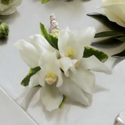 White Mini Cymbidium Boutonniere –  Jasmin Florist, S Richmond Hl NY
